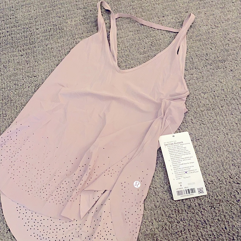Lulu lemon tank! Tags still on. Scoop neck back. Light purple tank!